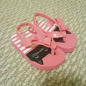 Pink cat flip flops